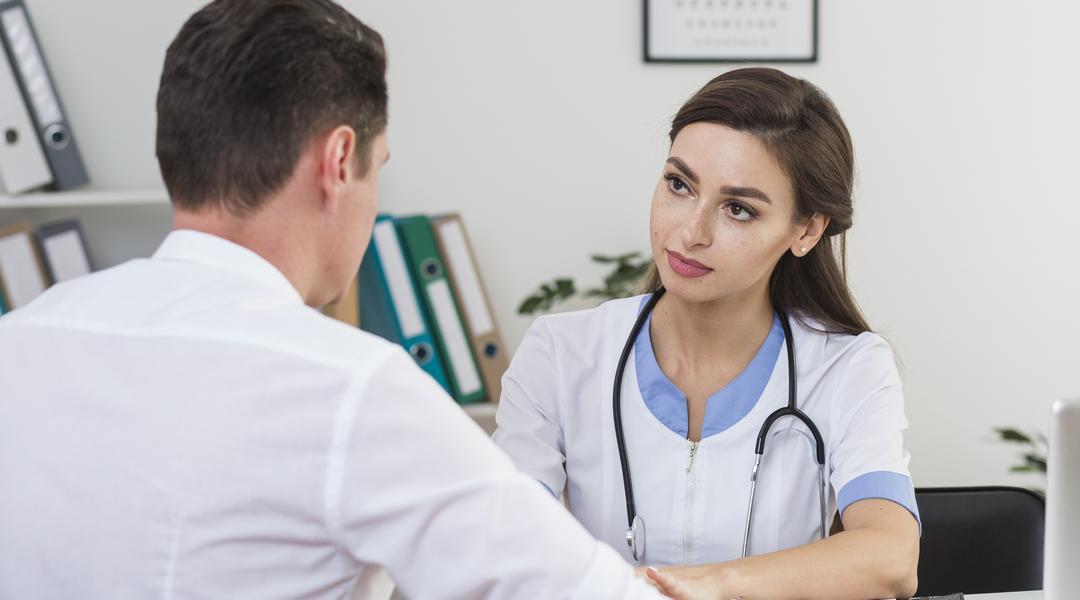 male patient talking with beautiful doctor
