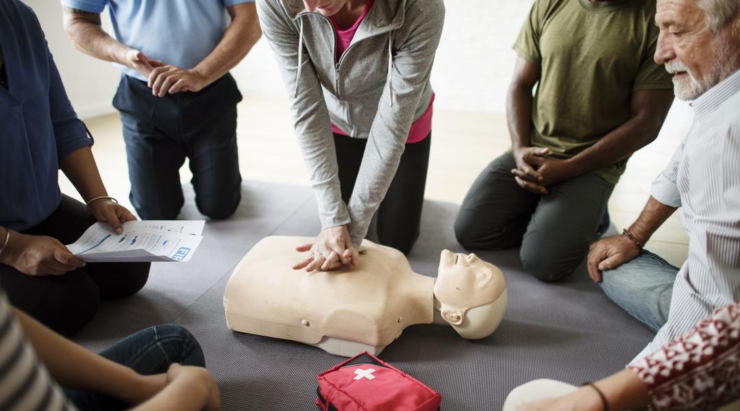 group diverse people cpr training class