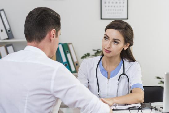 male patient talking with beautiful doctor