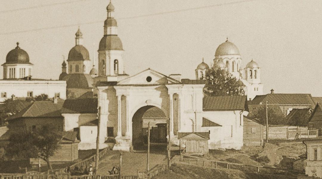 головна